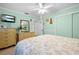 A bright bedroom features a floral patterned bedspread and lots of natural light at 8518 Delaware Dr, Weeki Wachee, FL 34607