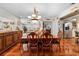 Formal dining room with a classic table set, adjacent to the kitchen, perfect for entertaining and Gathering gatherings at 8518 Delaware Dr, Weeki Wachee, FL 34607
