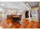 Classic dining room with detailed tile floor, chandelier, and adjoining rooms at 8518 Delaware Dr, Weeki Wachee, FL 34607