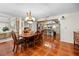 Elegant dining room featuring a stylish chandelier, a spacious table, and seamless access to the kitchen and living areas at 8518 Delaware Dr, Weeki Wachee, FL 34607