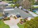 Lovely home with a lush landscaped yard and a circular driveway leading to a charming entrance at 8518 Delaware Dr, Weeki Wachee, FL 34607