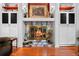 Close up on a traditional fireplace with mantel and built-in cabinets at 8518 Delaware Dr, Weeki Wachee, FL 34607