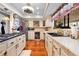 Bright kitchen features custom cabinets, modern appliances, and tiled floor at 8518 Delaware Dr, Weeki Wachee, FL 34607