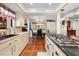 Bright kitchen with custom cabinets, granite countertops, and seamless flow into the dining area at 8518 Delaware Dr, Weeki Wachee, FL 34607