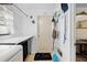 Laundry Room with folding station and black storage bags plus a door to the outside at 8518 Delaware Dr, Weeki Wachee, FL 34607