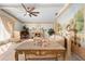 Spacious living room with a fireplace and a large mural. The room is filled with natural light and stylish decor at 8518 Delaware Dr, Weeki Wachee, FL 34607