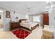 Main bedroom with a luxurious bed, dresser, and ensuite bathroom view at 8518 Delaware Dr, Weeki Wachee, FL 34607