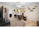 Office setup including a desk, office chair, large area rug, and view to the laundry room at 8518 Delaware Dr, Weeki Wachee, FL 34607