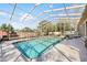 Enjoy the large, screened-in pool area, offering a private outdoor oasis for relaxation and entertainment at 8518 Delaware Dr, Weeki Wachee, FL 34607
