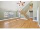 A bright living room features hardwood floors and a staircase to the upper level at 8759 Orient Ne Way, St Petersburg, FL 33702