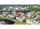 This is an aerial view of the home, showing the community, ponds, and shopping nearby at 8906 Iron Oak Ave, Tampa, FL 33647