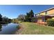 Beautiful backyard with a screened-in patio and a pond at 8906 Iron Oak Ave, Tampa, FL 33647