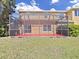 A nice, screened-in lanai offers a great spot to enjoy the outdoors while staying cool at 8906 Iron Oak Ave, Tampa, FL 33647