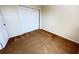 Bedroom featuring carpet, neutral walls, and a closet with sliding doors at 8906 Iron Oak Ave, Tampa, FL 33647