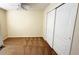 Cozy bedroom with a ceiling fan and spacious closet with sliding doors at 8906 Iron Oak Ave, Tampa, FL 33647