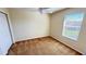 Comfortable bedroom with a ceiling fan and natural light from the window at 8906 Iron Oak Ave, Tampa, FL 33647