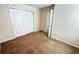 Bedroom with a ceiling fan and a spacious closet with sliding doors at 8906 Iron Oak Ave, Tampa, FL 33647