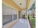 Welcoming front porch with white railing, offering an inviting entrance to the home at 8906 Iron Oak Ave, Tampa, FL 33647