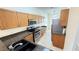 Kitchen with stainless steel appliances, granite countertops, and ample cabinet space at 8906 Iron Oak Ave, Tampa, FL 33647