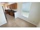 Open kitchen with wood cabinets, stainless appliances and granite countertops at 8906 Iron Oak Ave, Tampa, FL 33647