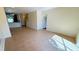 Bright living room with tile flooring and a view to the stairs at 8906 Iron Oak Ave, Tampa, FL 33647