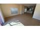 Open living area showcasing tile floors, neutral paint, and an open layout to the kitchen at 8906 Iron Oak Ave, Tampa, FL 33647