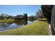 Scenic pond with green landscape perfect for relaxation and peaceful enjoyment at 8906 Iron Oak Ave, Tampa, FL 33647