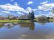This home is beautifully situated, with lovely water views and mature landscaping at 8906 Iron Oak Ave, Tampa, FL 33647