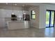 Bright, open-concept kitchen with stainless steel appliances and a spacious center island at 9 Tee View Rd, Rotonda West, FL 33947