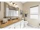 A relaxing bathroom featuring a vanity sink, toilet, and a shower at 9408 Bluebird Dr, Tampa, FL 33647