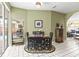 An elegant dining area features bright light with an exterior door to the pool at 9408 Bluebird Dr, Tampa, FL 33647