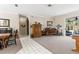 Open-concept living space seamlessly connects the dining area to the living room with a view to the pool area at 9408 Bluebird Dr, Tampa, FL 33647