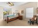 Comfortable main bedroom with a ceiling fan and lots of natural light at 9408 Bluebird Dr, Tampa, FL 33647
