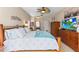 Comfortable main bedroom with a ceiling fan and lots of natural light at 9408 Bluebird Dr, Tampa, FL 33647
