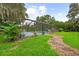 Screen enclosed pool with mature landscaping at 1001 Crocker Ln, Plant City, FL 33565