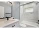 Bathroom featuring a marble tiled shower/tub with black hardware and modern fixtures at 10047 41St N St # 10047, Pinellas Park, FL 33782