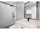 Beautiful bathroom featuring a marble tiled shower with black hardware and modern fixtures at 10047 41St N St # 10047, Pinellas Park, FL 33782