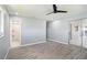 Spacious bedroom featuring hard surface floors and sliding door access at 10047 41St N St # 10047, Pinellas Park, FL 33782