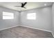 Bedroom featuring modern gray walls, luxury vinyl flooring, and a ceiling fan at 10047 41St N St # 10047, Pinellas Park, FL 33782