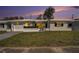 Charming home with a well-manicured lawn and mature palm trees at 10047 41St N St # 10047, Pinellas Park, FL 33782