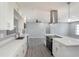 Bright kitchen with modern appliances, white cabinets, and quartz countertops provides a clean and stylish cooking space at 10047 41St N St # 10047, Pinellas Park, FL 33782