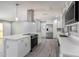 Modern kitchen with island, stainless appliances, and quartz countertops at 10047 41St N St # 10047, Pinellas Park, FL 33782