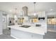 Modern kitchen with island, stainless appliances, and quartz countertops at 10047 41St N St # 10047, Pinellas Park, FL 33782