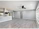 Spacious living room featuring hard surface floors and modern ceiling fans at 10047 41St N St # 10047, Pinellas Park, FL 33782