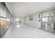 Spacious sunroom featuring large windows and sliding glass doors at 10047 41St N St # 10047, Pinellas Park, FL 33782