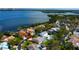 Aerial view of waterfront homes, showcasing the pool, patio, and access to the bay, creating a relaxing atmosphere at 1034 Marco Ne Dr, St Petersburg, FL 33702