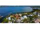 Aerial view of waterfront homes, showcasing the pool, patio, and access to the bay, creating a relaxing atmosphere at 1034 Marco Ne Dr, St Petersburg, FL 33702