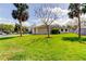 Well-manicured lawn with mature trees surrounding this single-Gathering home in a residential neighborhood at 1034 Marco Ne Dr, St Petersburg, FL 33702