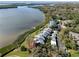 Stunning aerial view of waterfront condos, lush landscaping, and tranquil bay waters at 1111 N Bayshore Blvd # F11, Clearwater, FL 33759