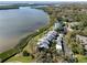 Stunning aerial view of waterfront condos, lush landscaping, and tranquil bay waters at 1111 N Bayshore Blvd # F11, Clearwater, FL 33759